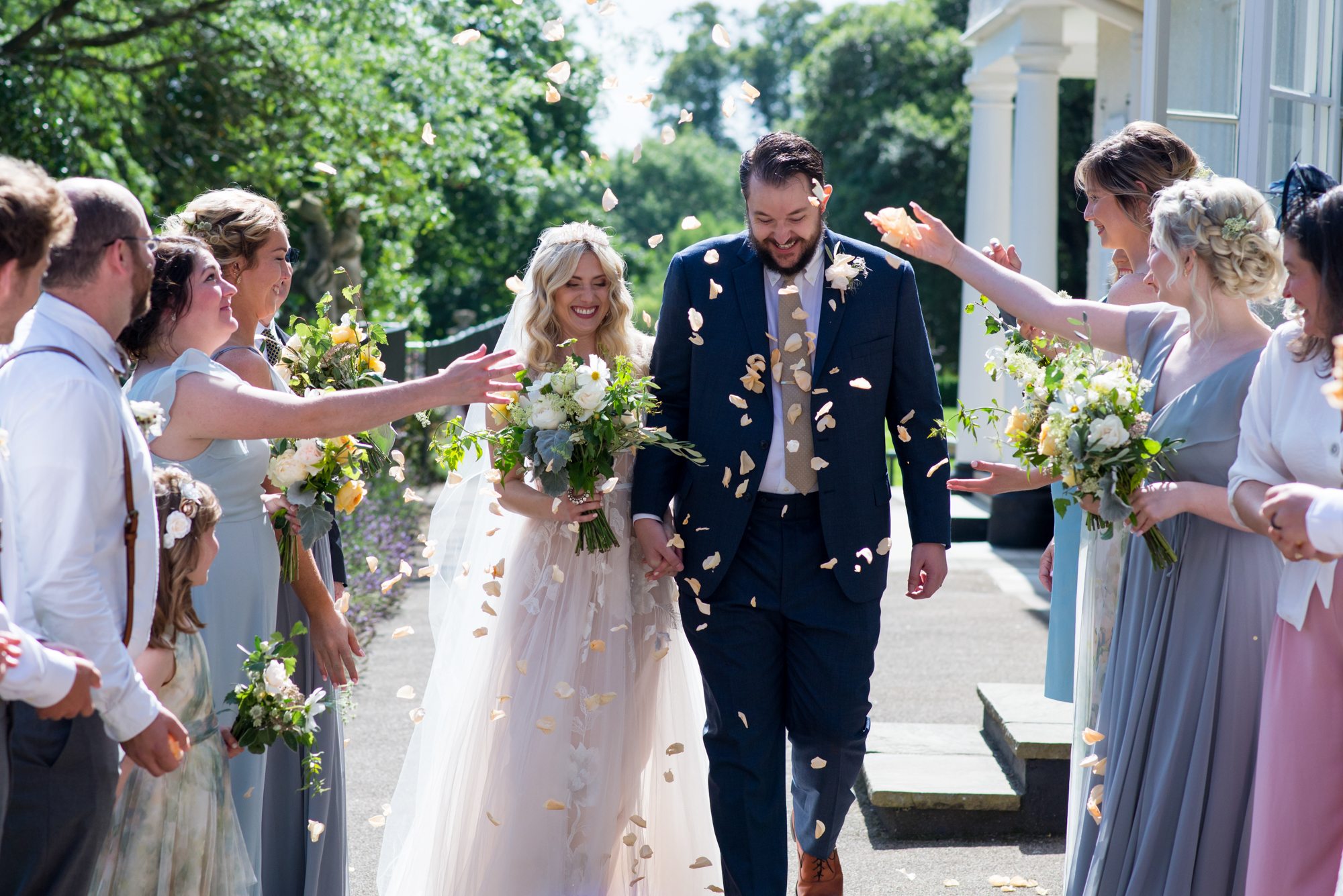 bride and groom with confetti at Lauderdale House in Highgate at their micro wedding